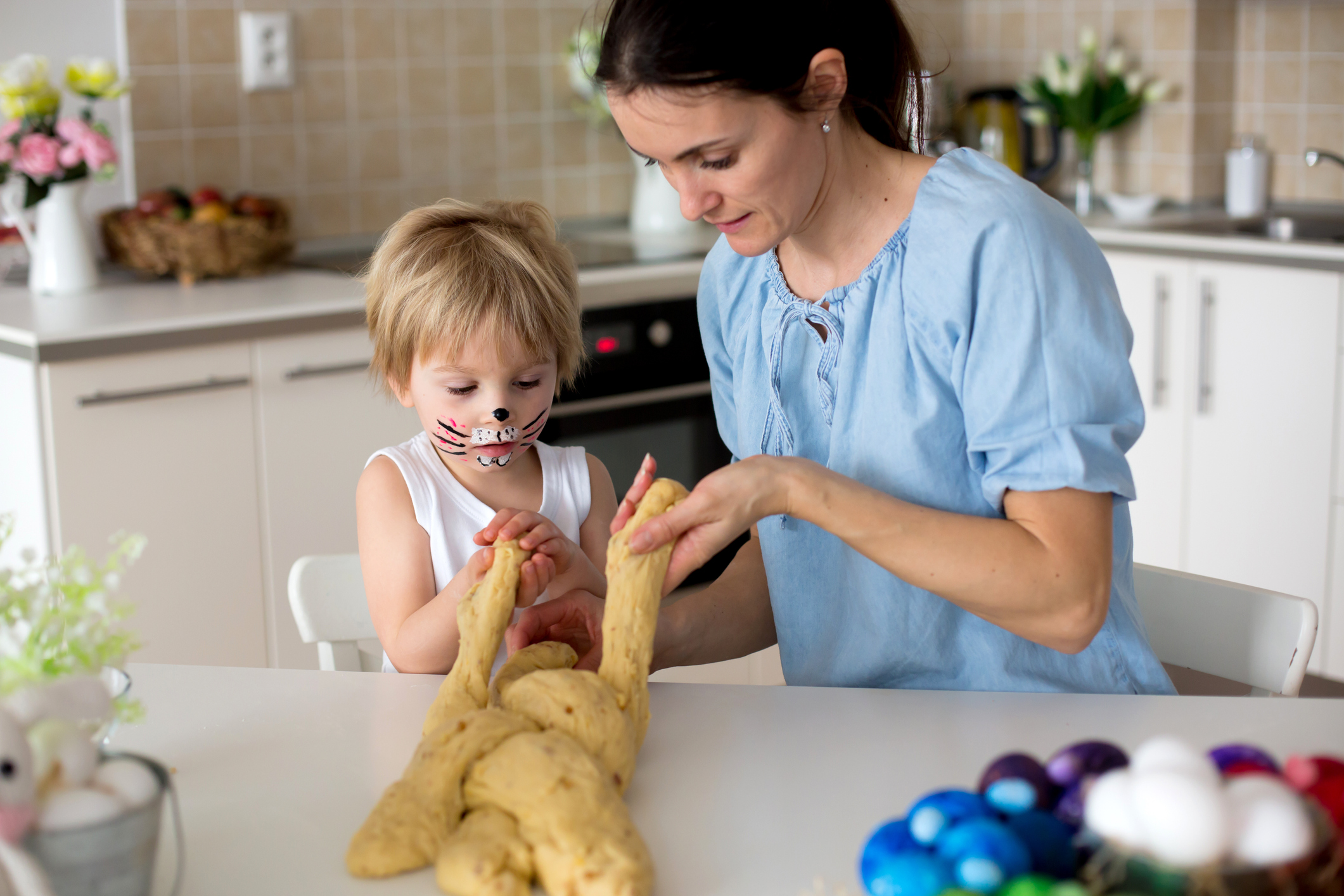 Mother and child making bread.
