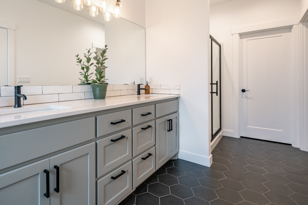 modern farmhouse bathroom with dark hexagonal tiles