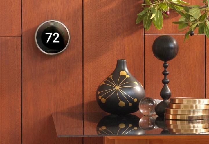 Nest Thermostat on wall with wood paneling