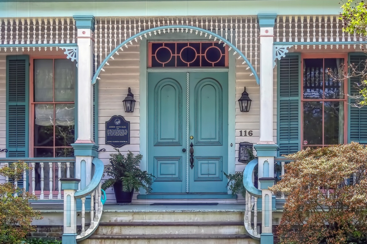 Pink and blue house front door front porch