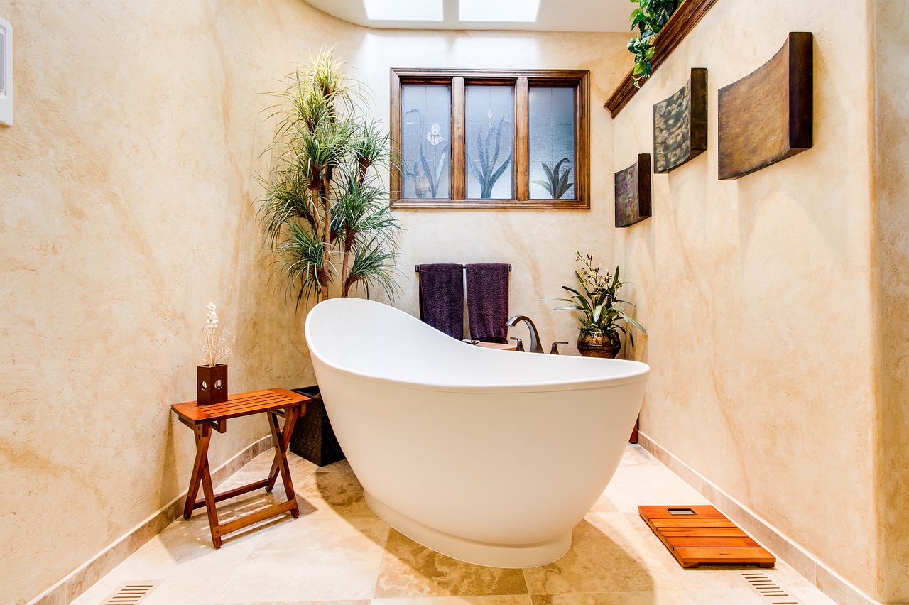 soaker tub surrounded by wood decor and greenery