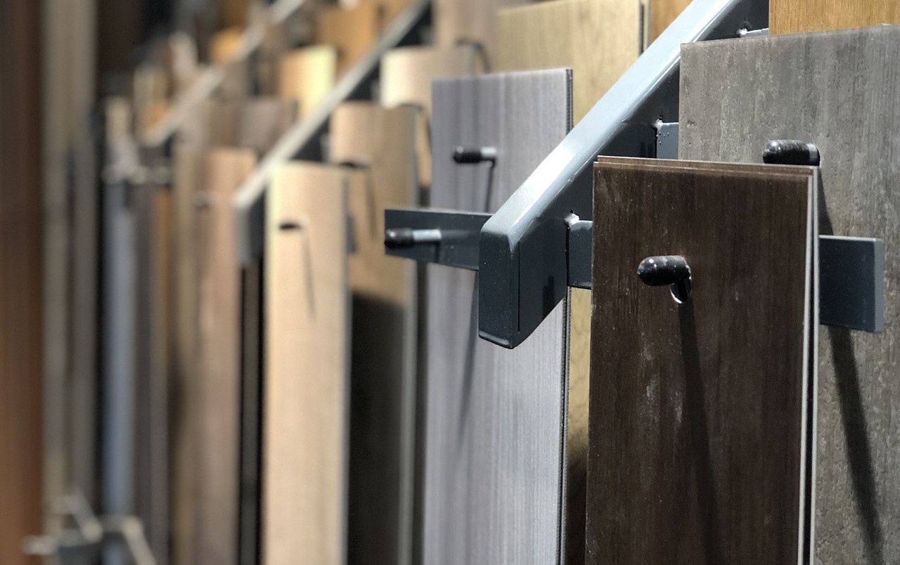 selection of parquet flooring panels hanging on pegs