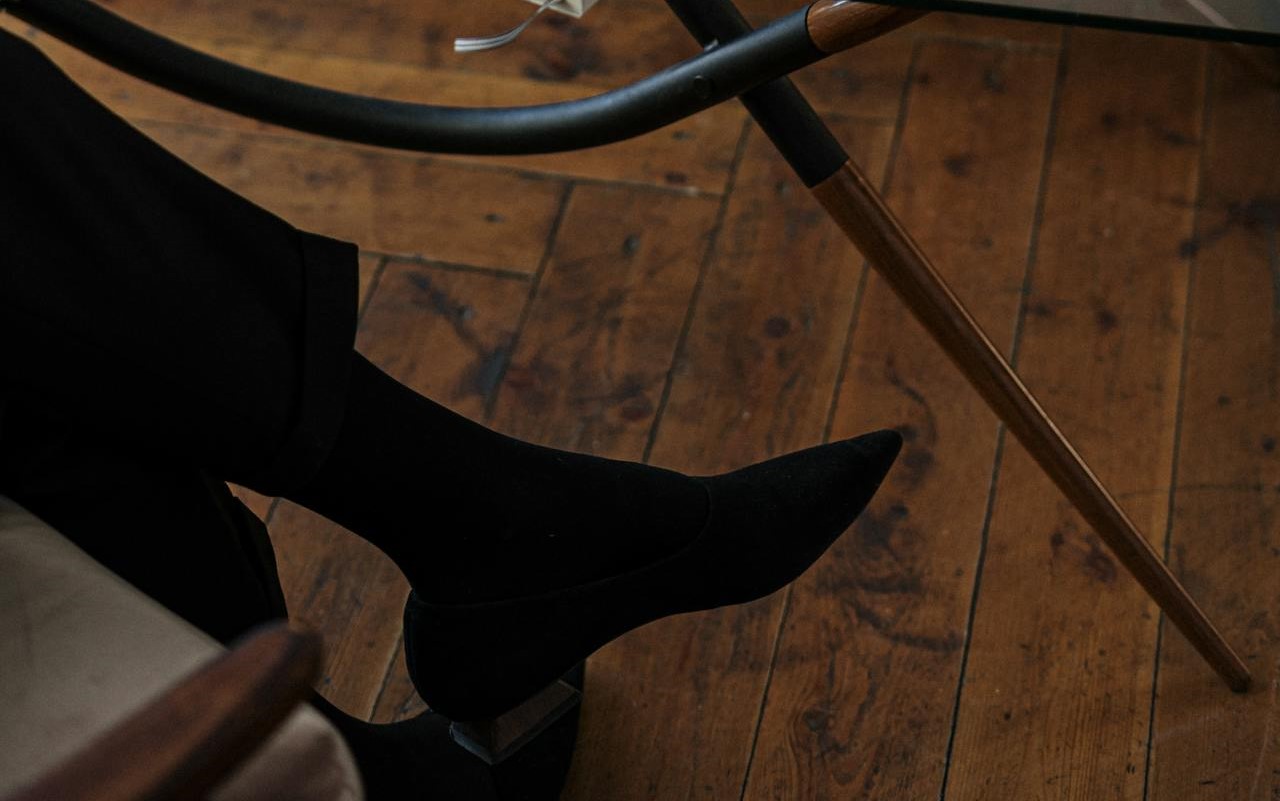 Woman's feet on parquet flooring