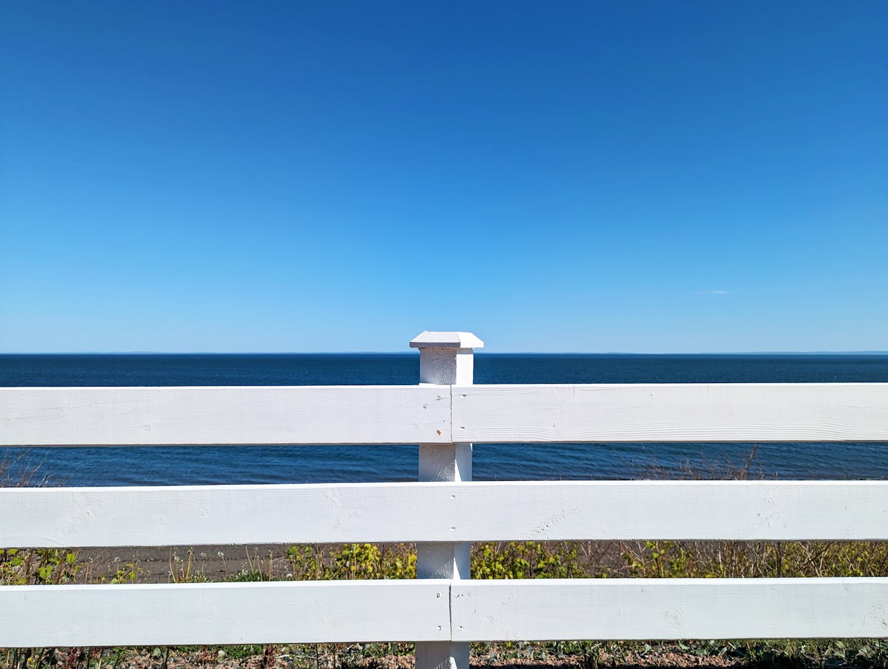 white horizontal deck railing with ocean view