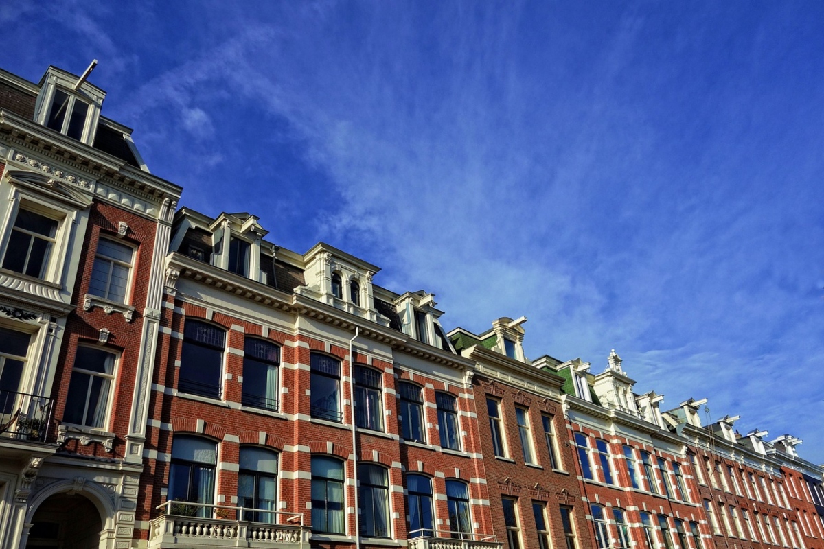 row of historic townhomes from lower angle