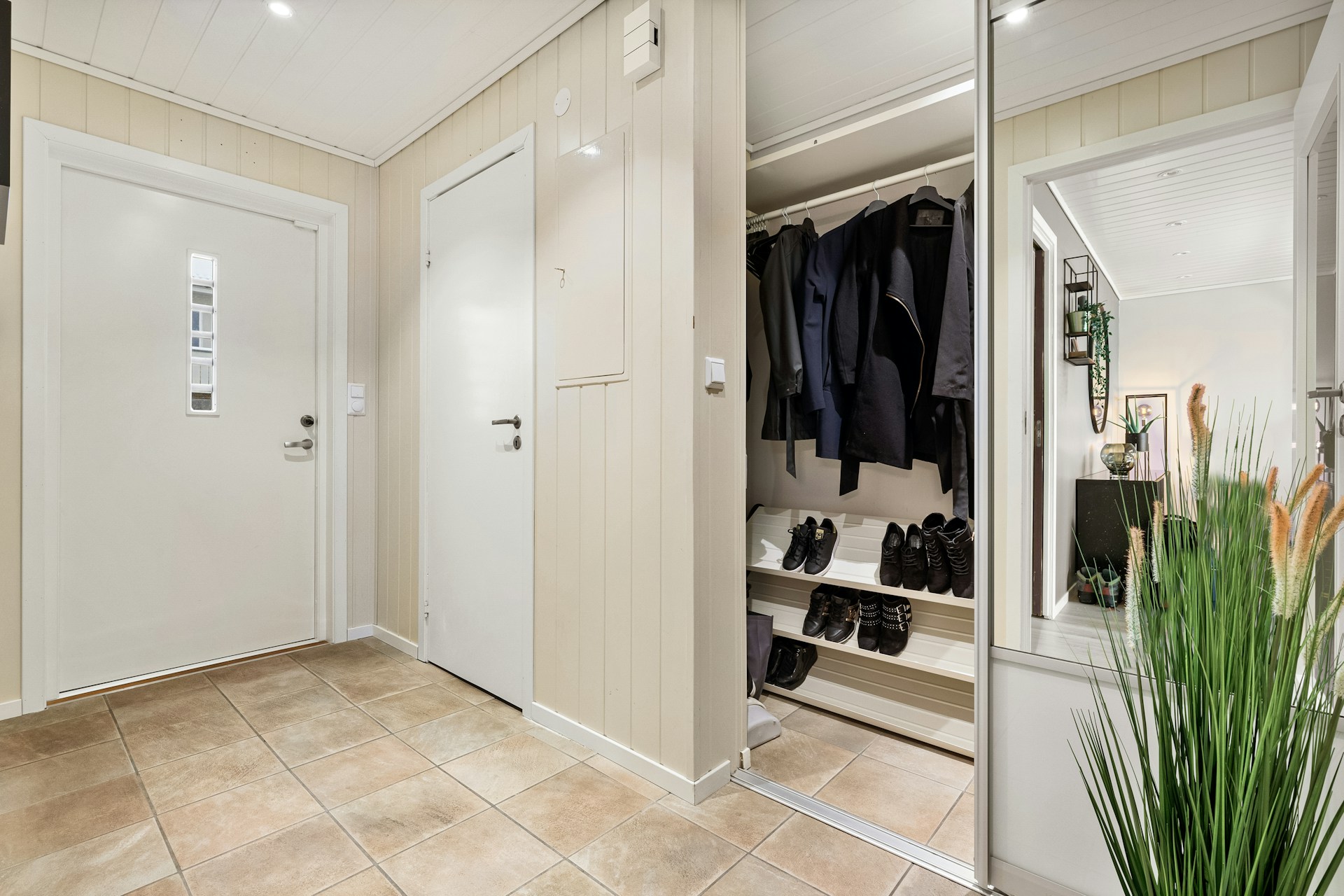 Angled shoe shelves in a hall closet