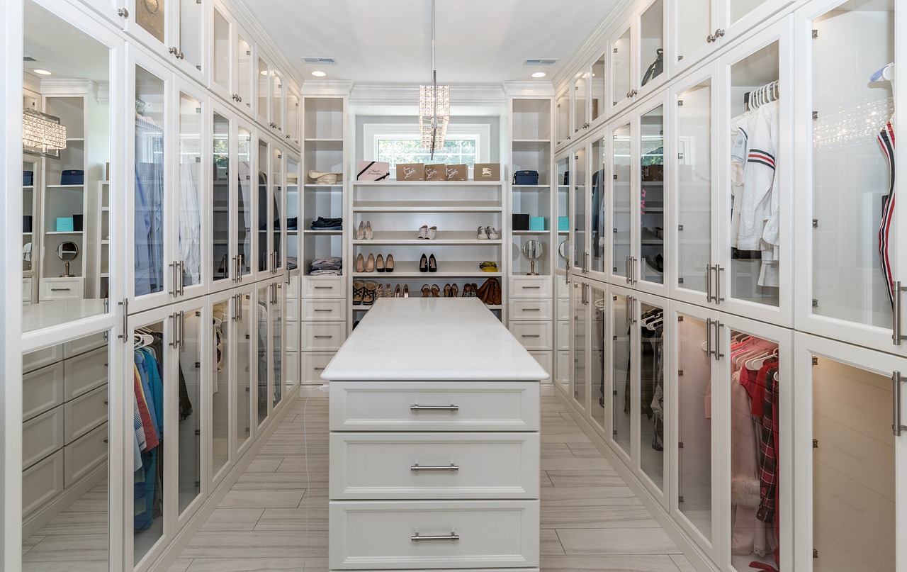 floor to ceiling storage in a walk in closet with island