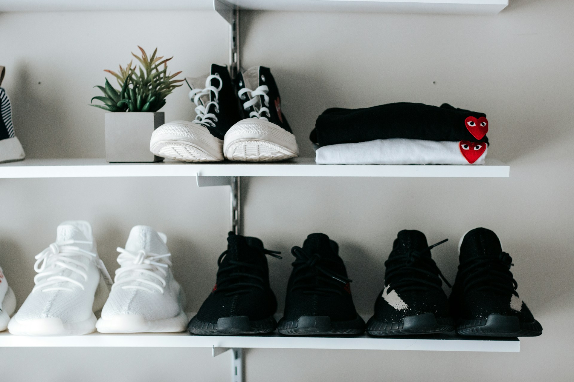 white floating shelves storing shoes