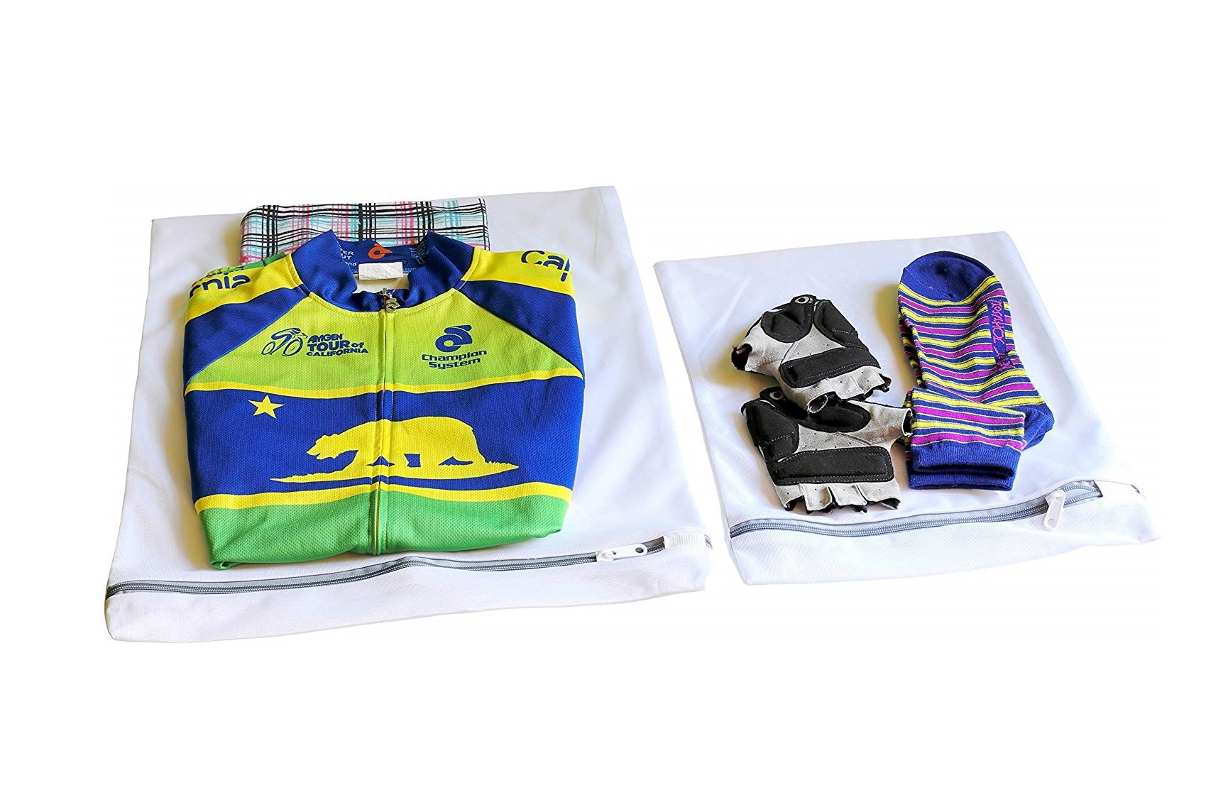 Two SimpleHouseware Laundry Wash Bags with clothes folded on top of them.