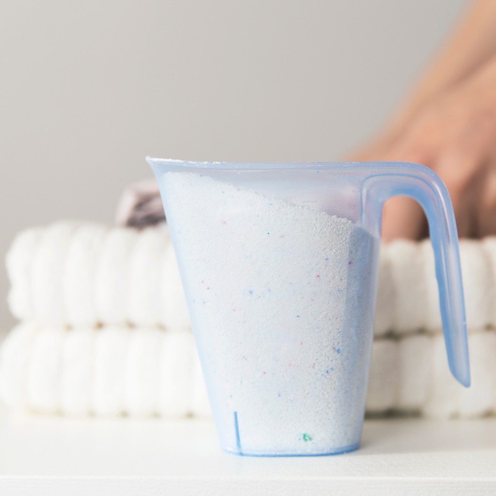 Natural laundry detergent cup and towels