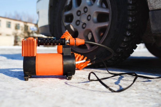 the best car lifts for your garage air compressor in working position at snow  self inflating