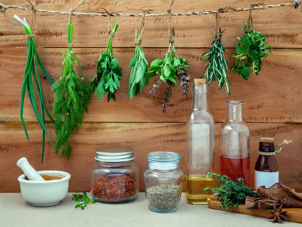 Herbs drying above shelf