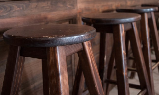 the best wooden stools for your kitchen bar empty in row at restaurant