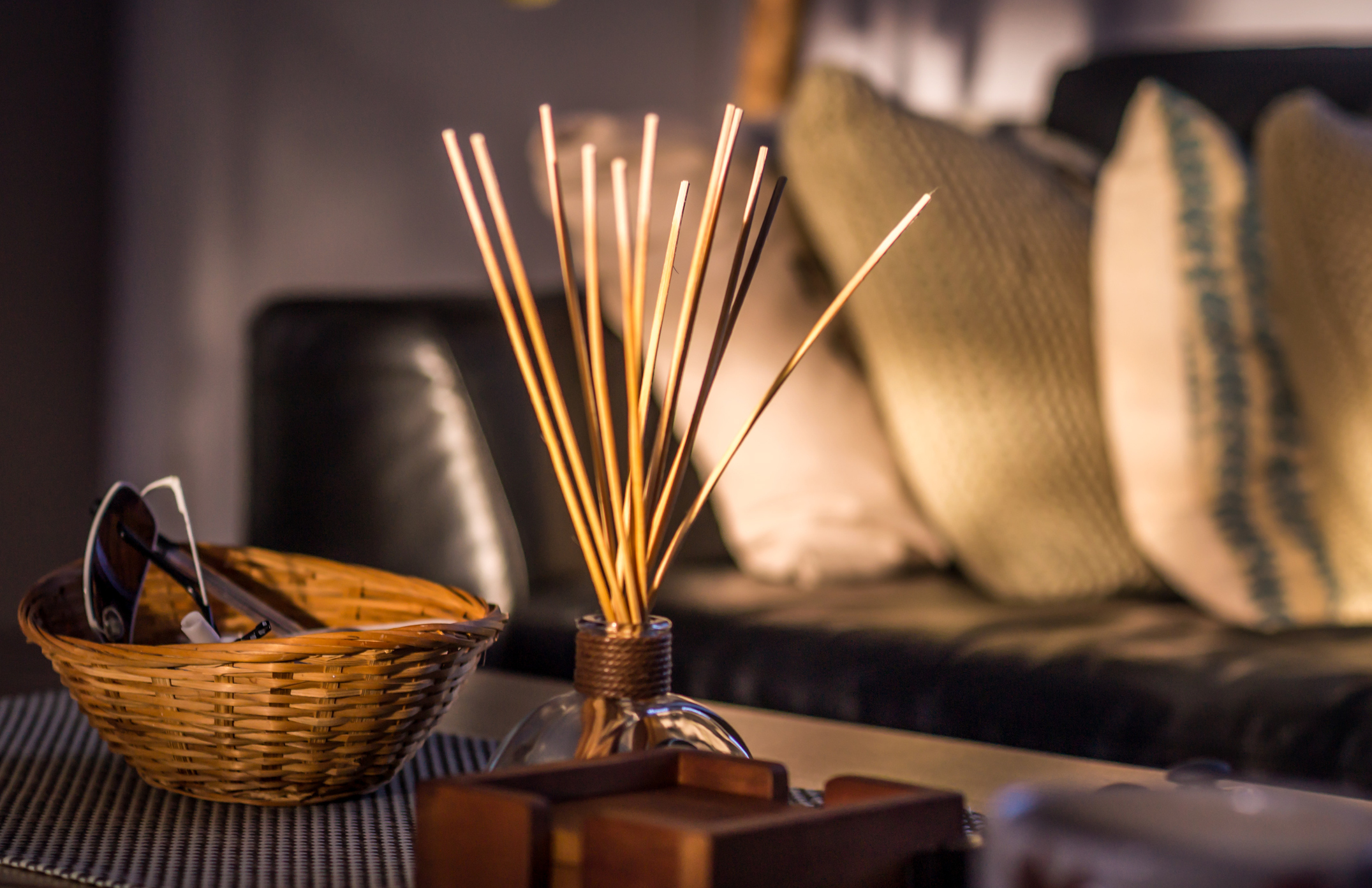 incense sticks in jar on coffee table in living room