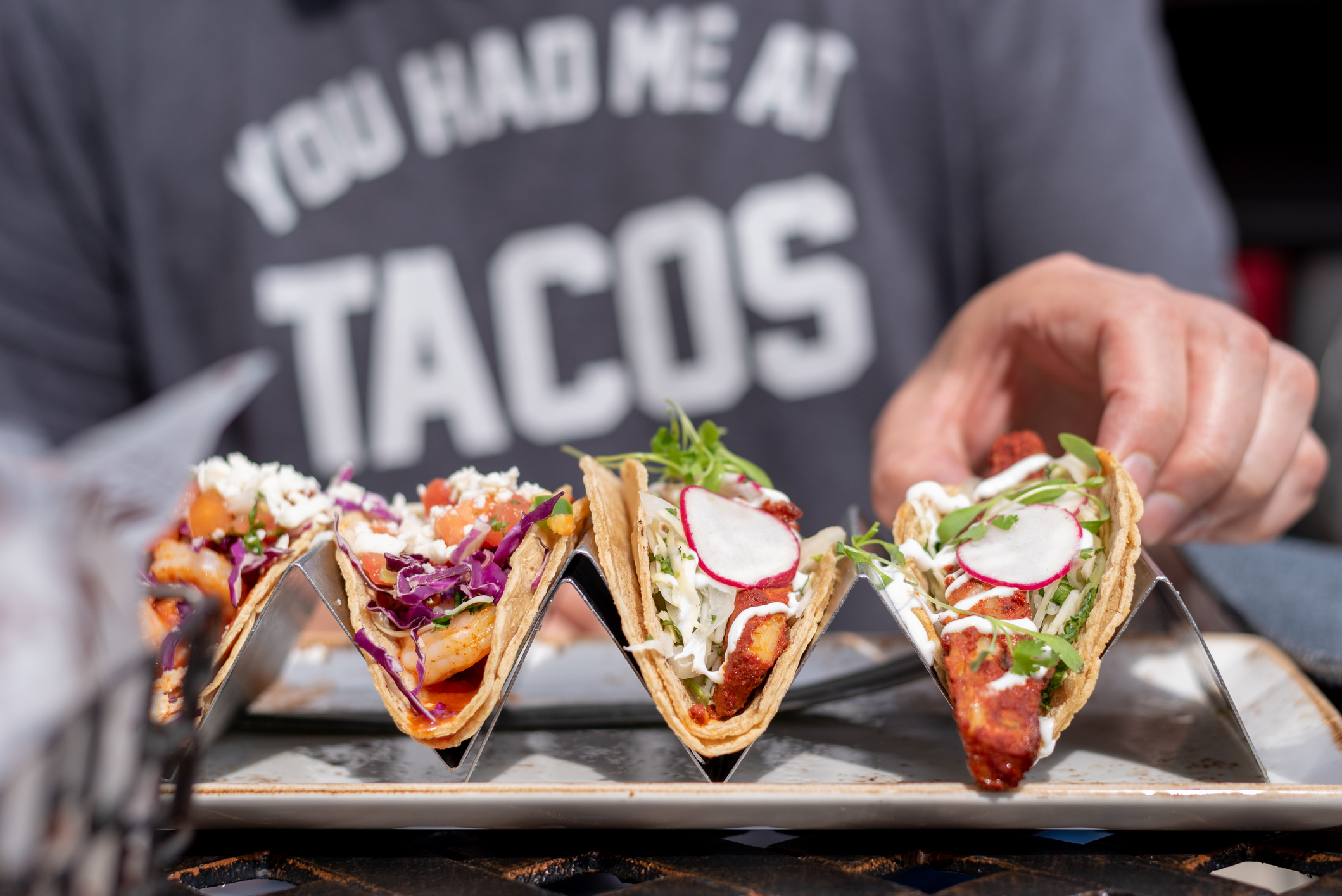 closeup of four tacos on a plate
