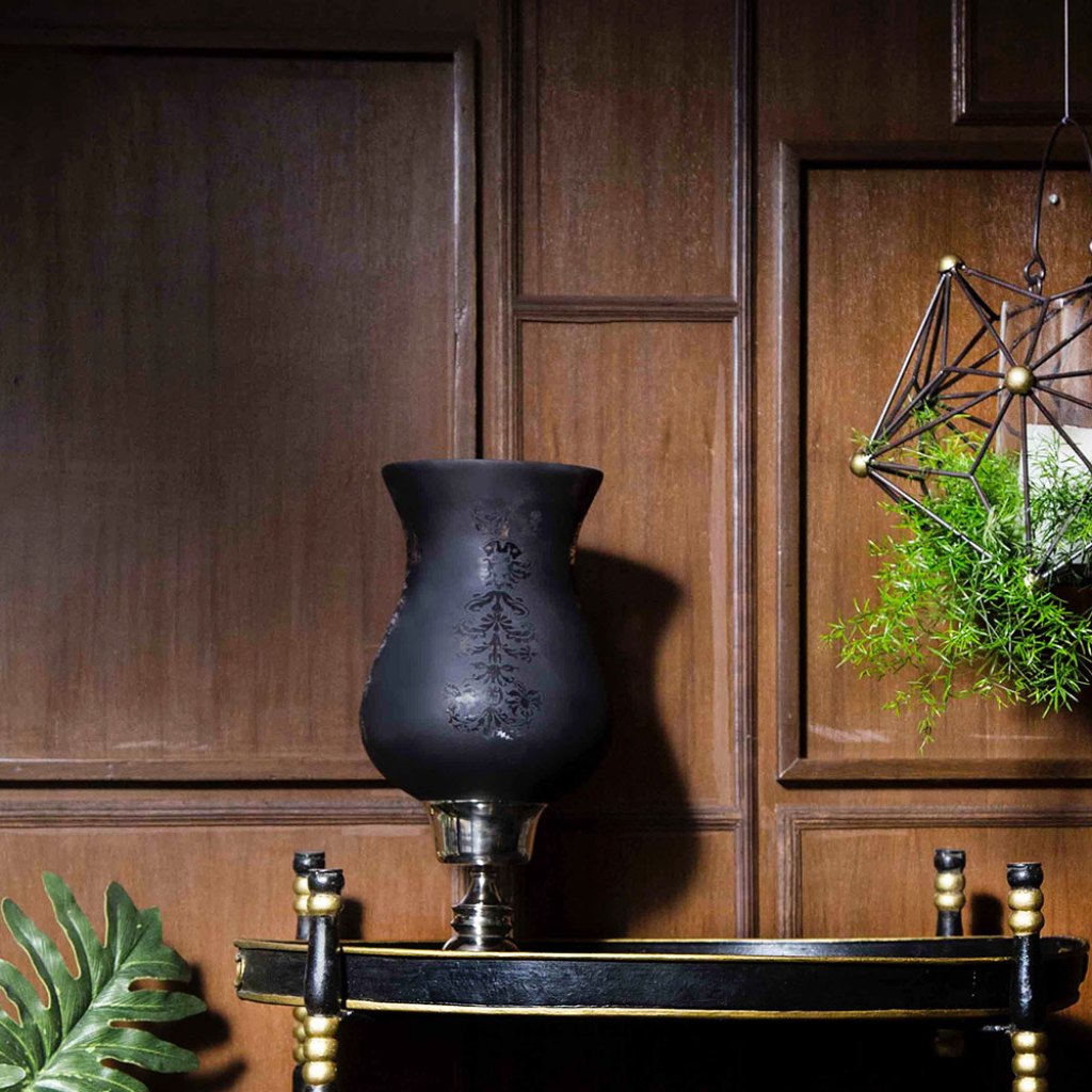 Hanging plant in front of wood panels