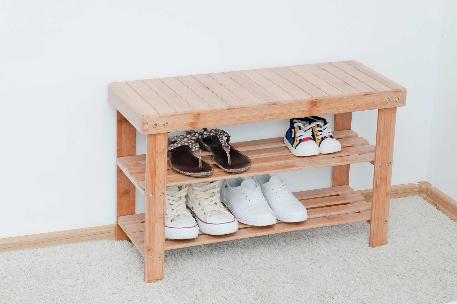 Wooden bench storing shoes