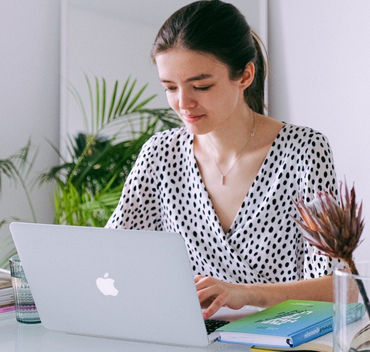 Woman working at home with laptop computer