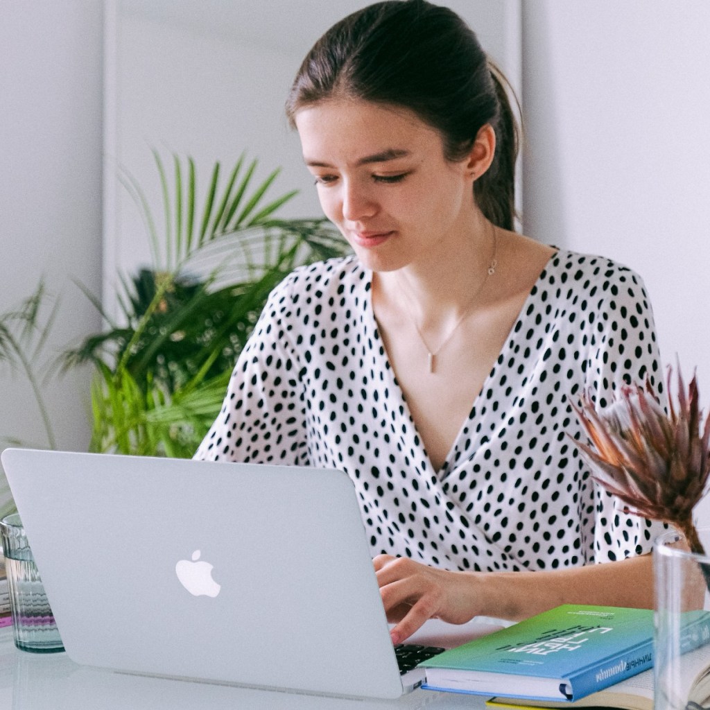 Woman working at home with laptop computer