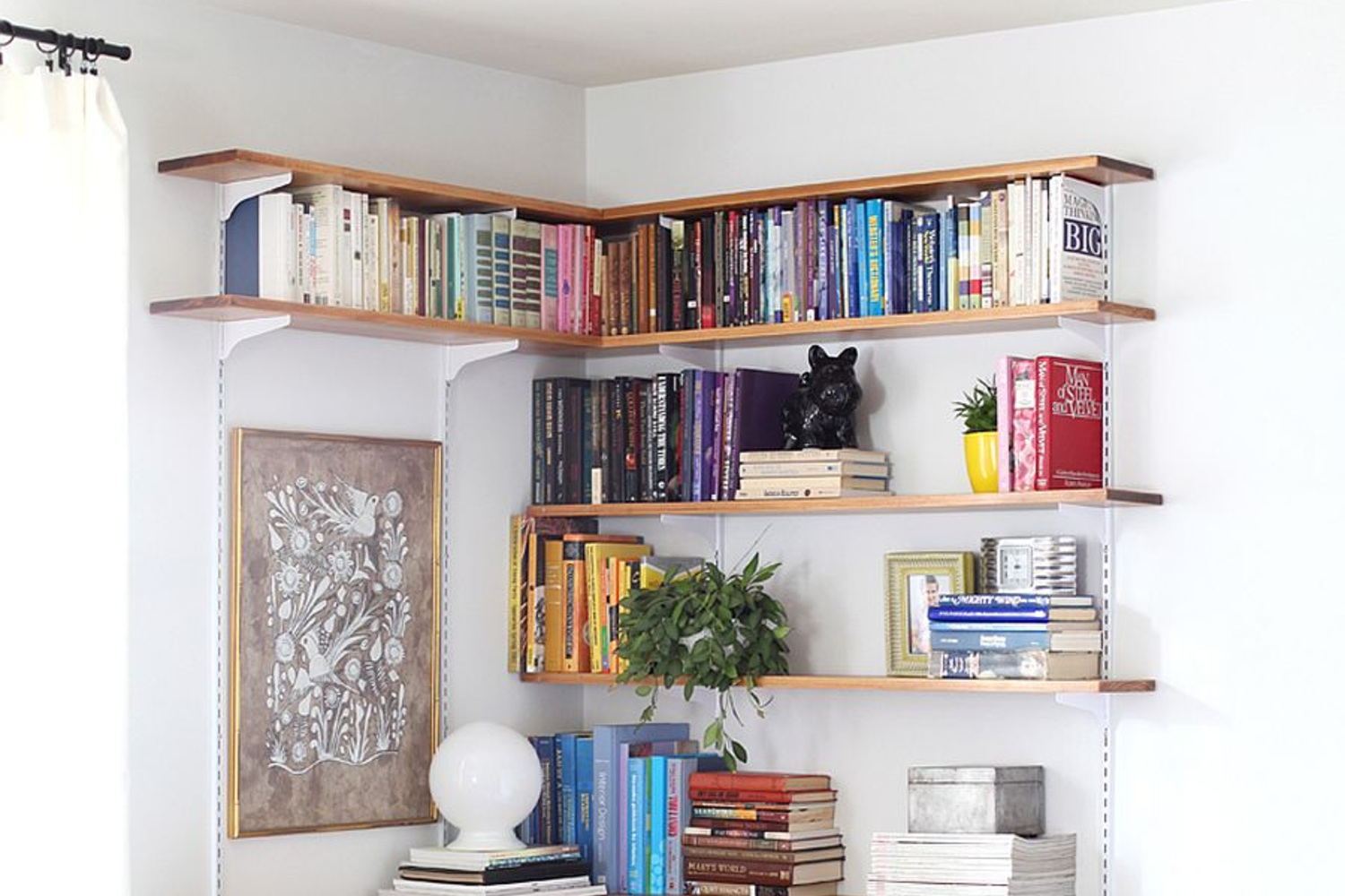 Corner shelves with colorful books