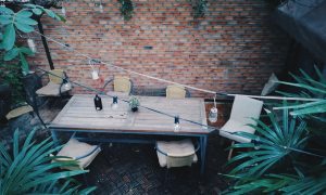 outdoor patio with brick wall and plants
