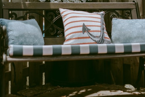 Three cushions on backyard bench