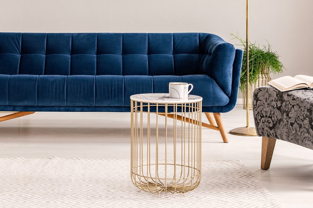 Blue velvet couch and table