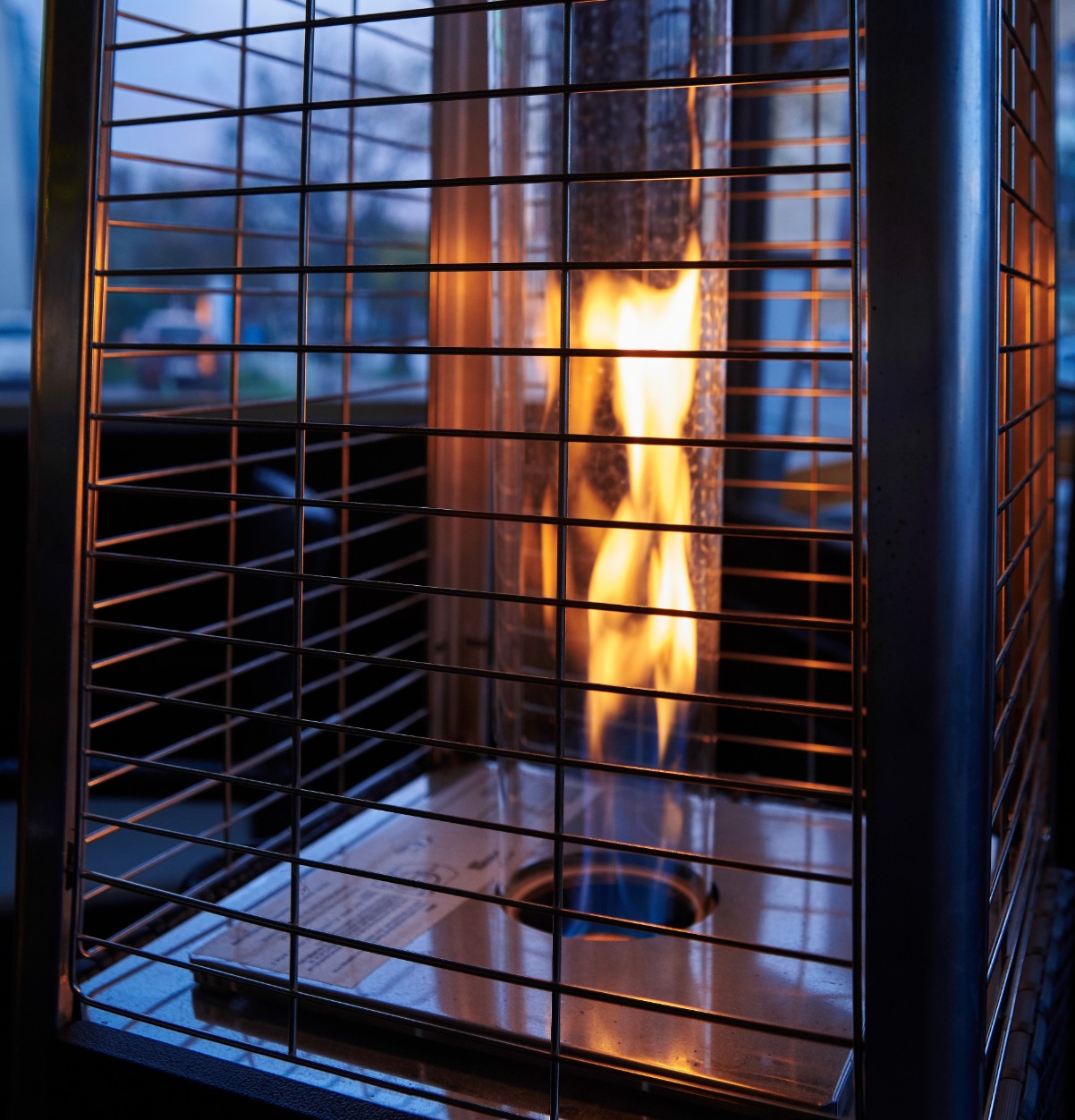 Tall outdoor heater at night
