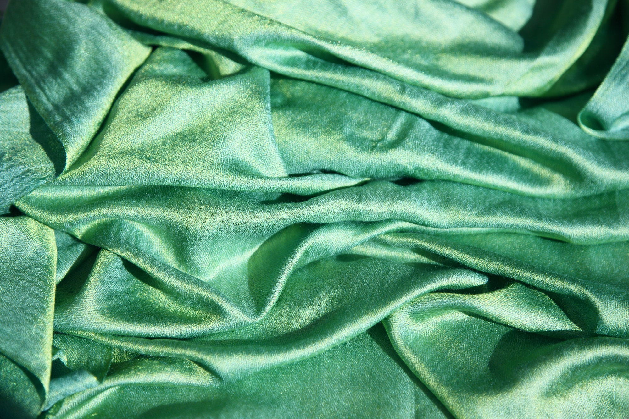 large piece of green silk fabric