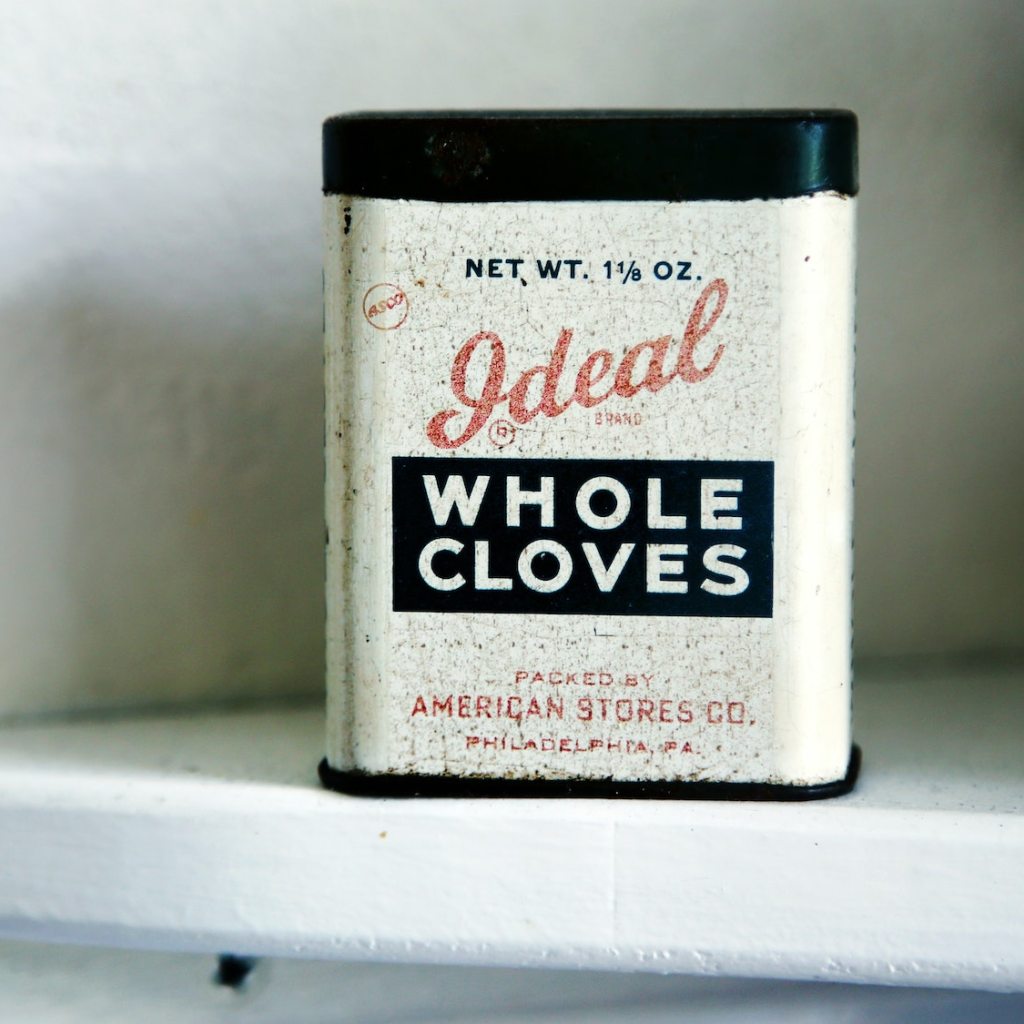 retro clove tin on white shelf