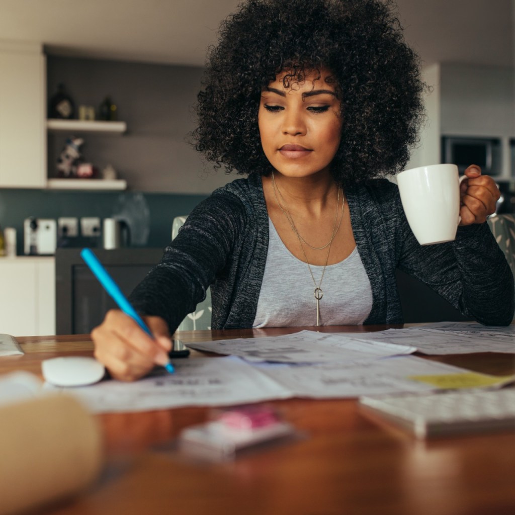 Woman working at desk of her home office