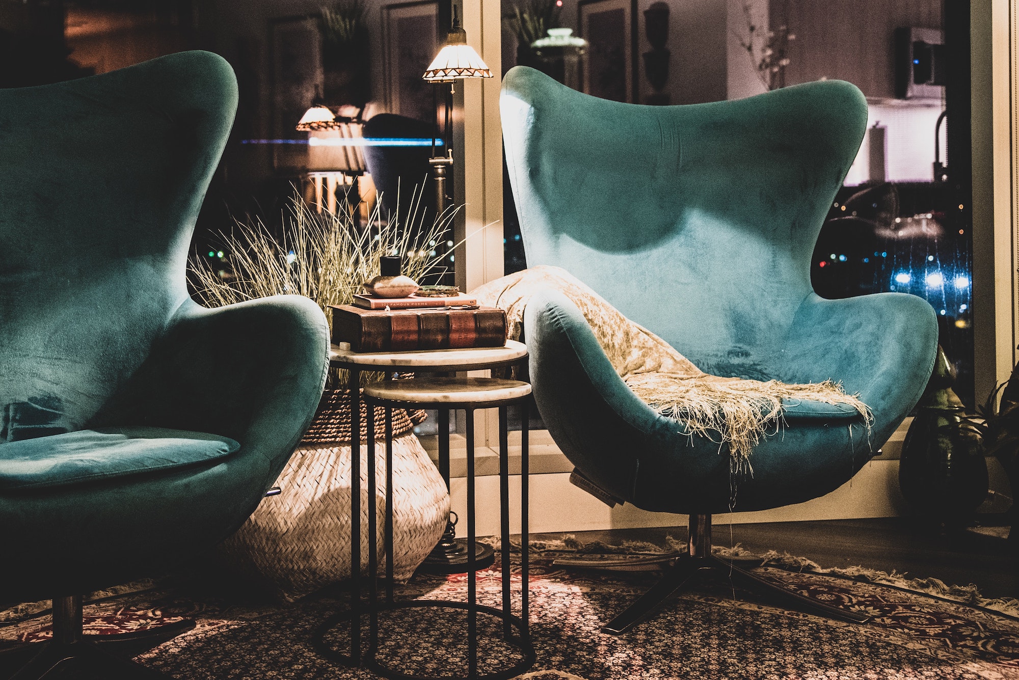 two teal scoop armchairs in living room