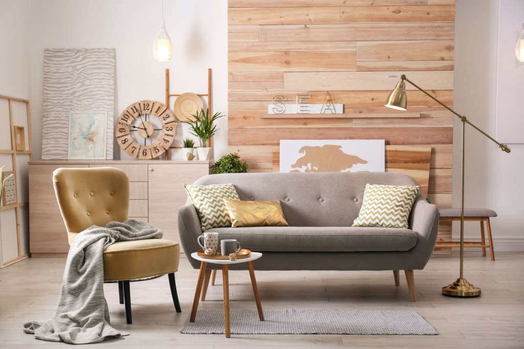 Stylish apartment living room with small, comfortable sofa
