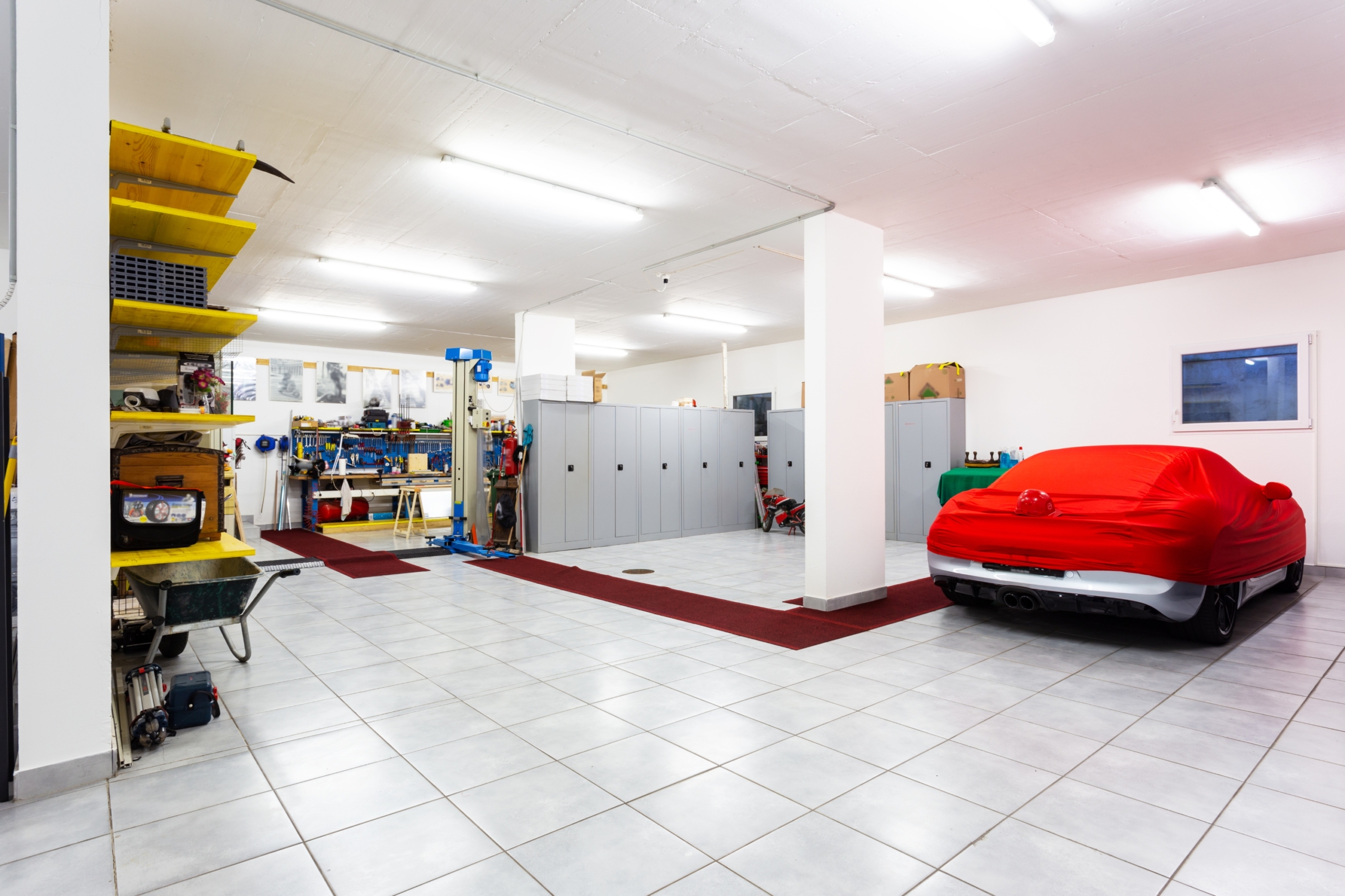 fancy garage with white tiles
