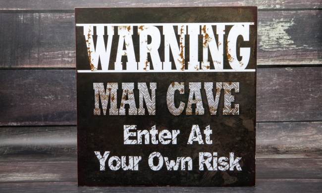 Wooden "man cave" sign hung up on a wall