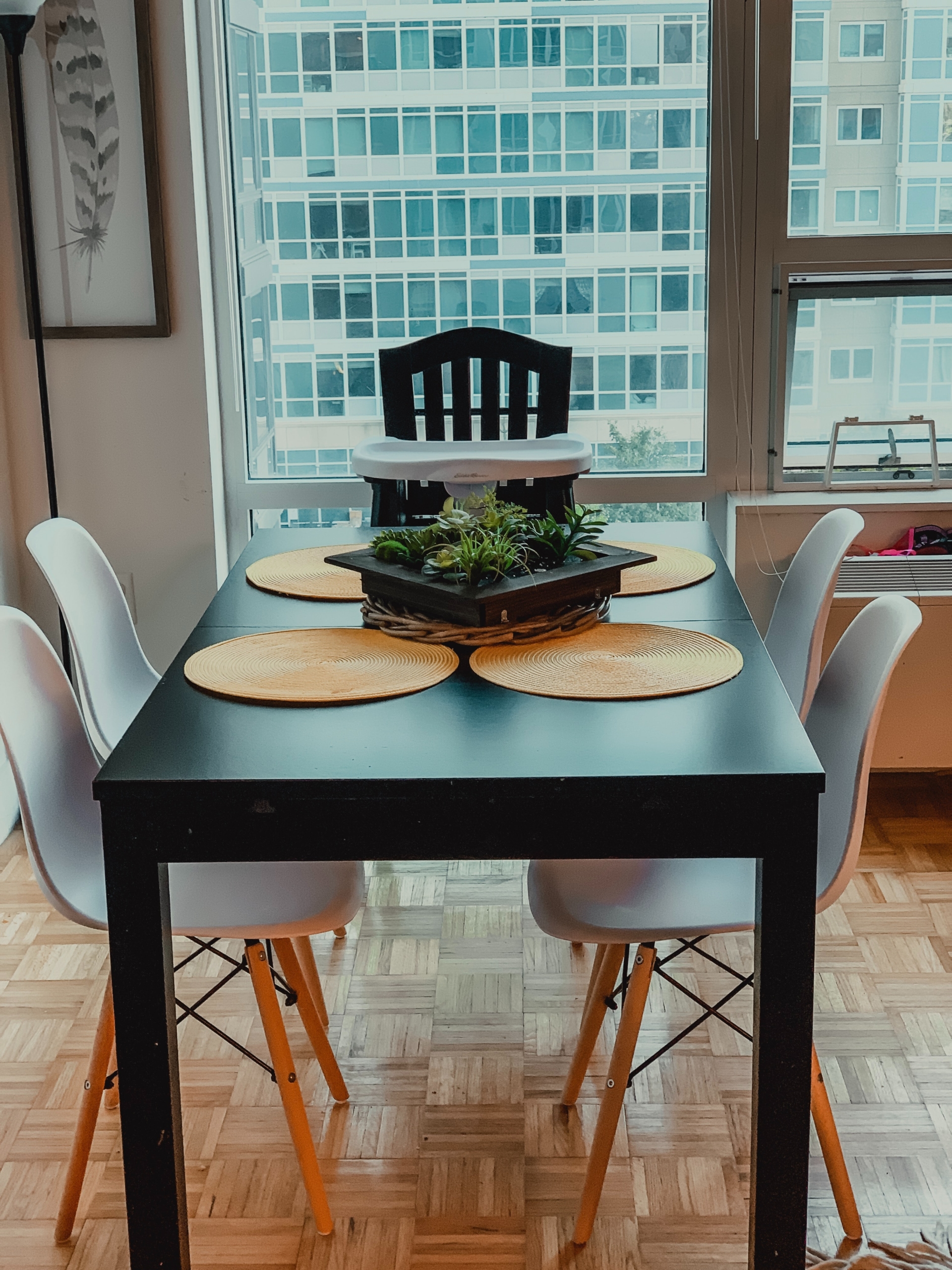 black table with white chairs