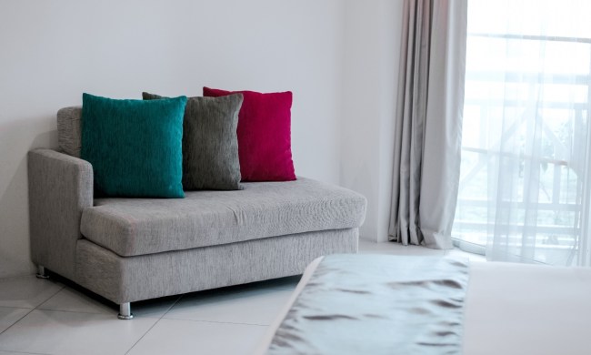gray couch with pillows