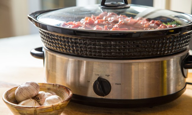 Slow cooker on table with food