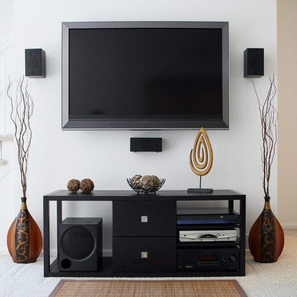 Wall-mounted TV with entertainment center below