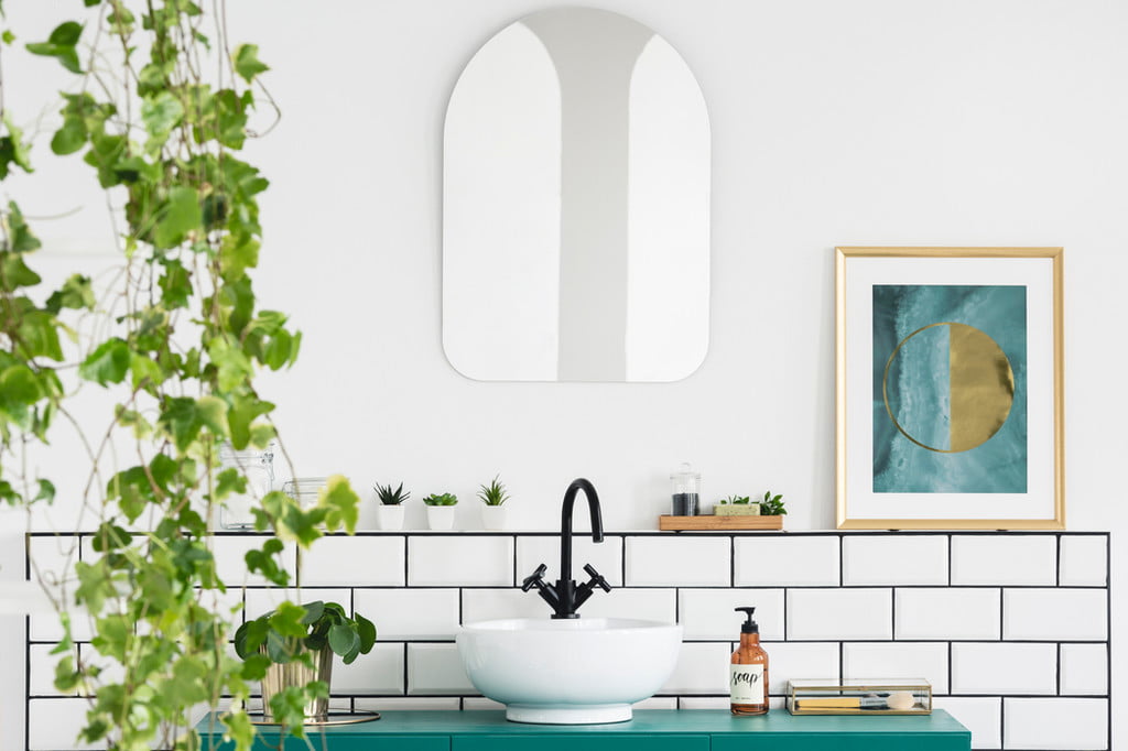 Bathroom with plant and wall art