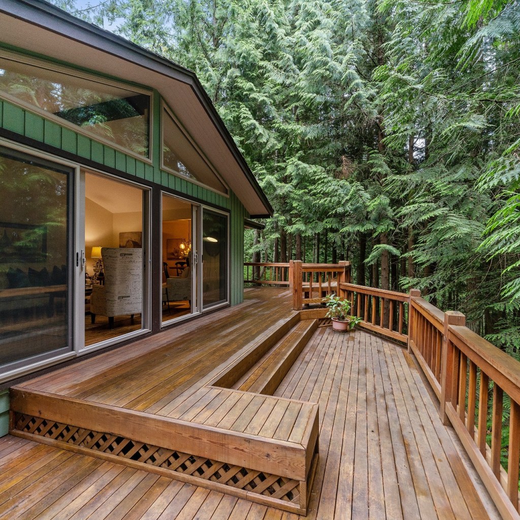 deck with railing overlooking woods