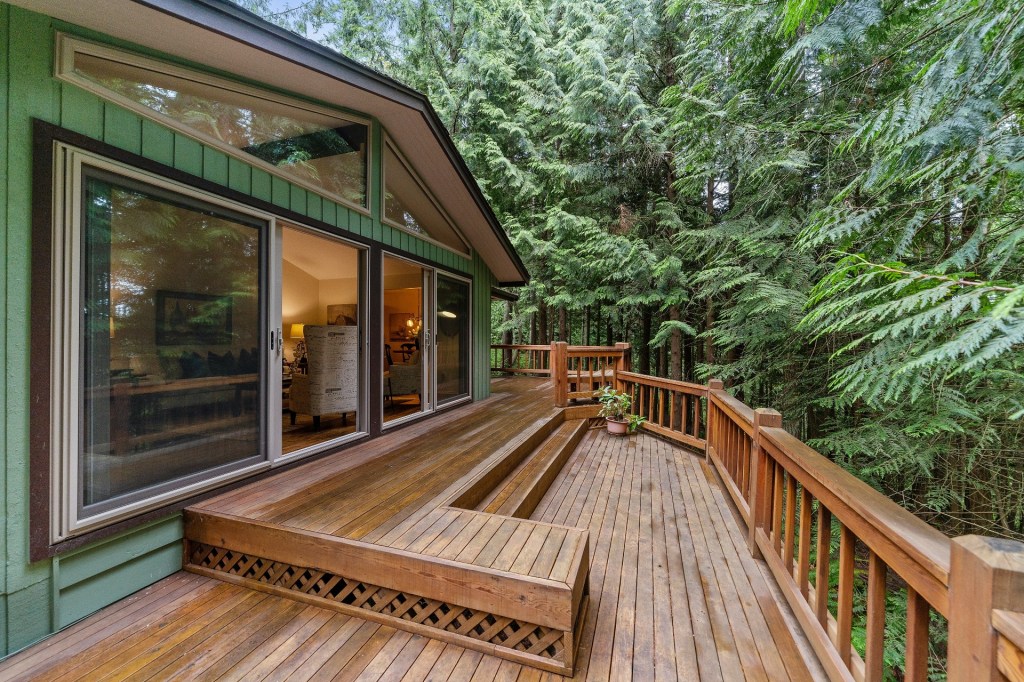 Deck with railing overlooking woods