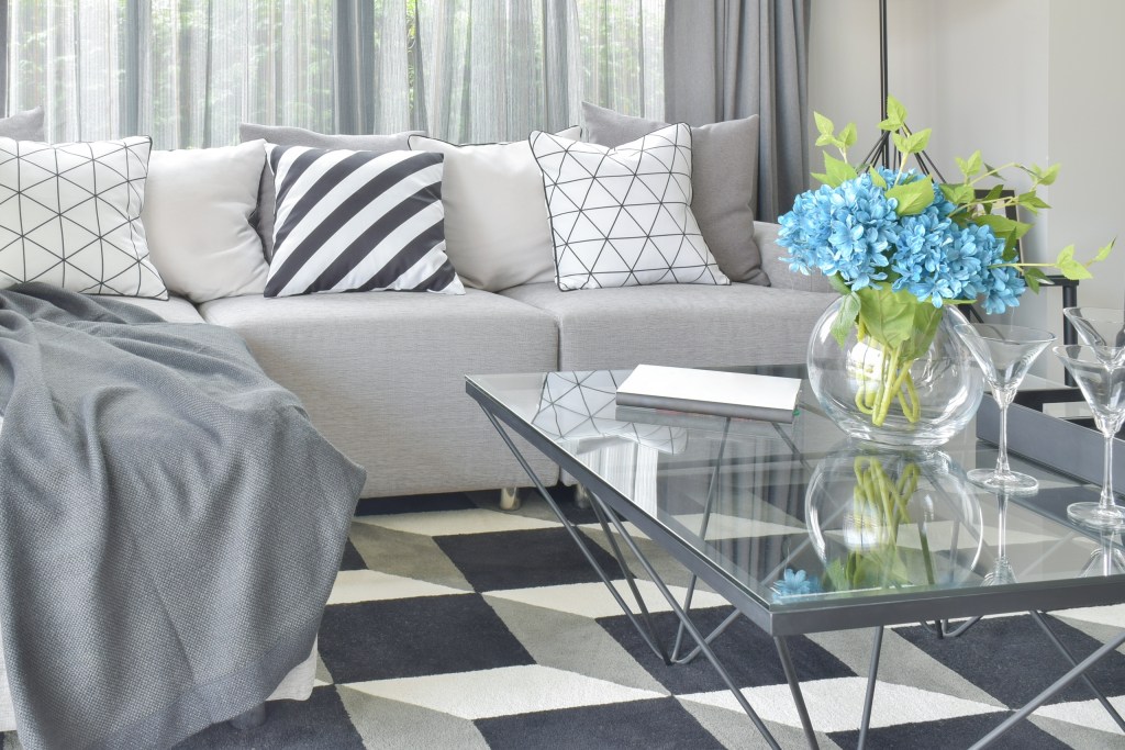 grey sofa and carpet tiles in living room