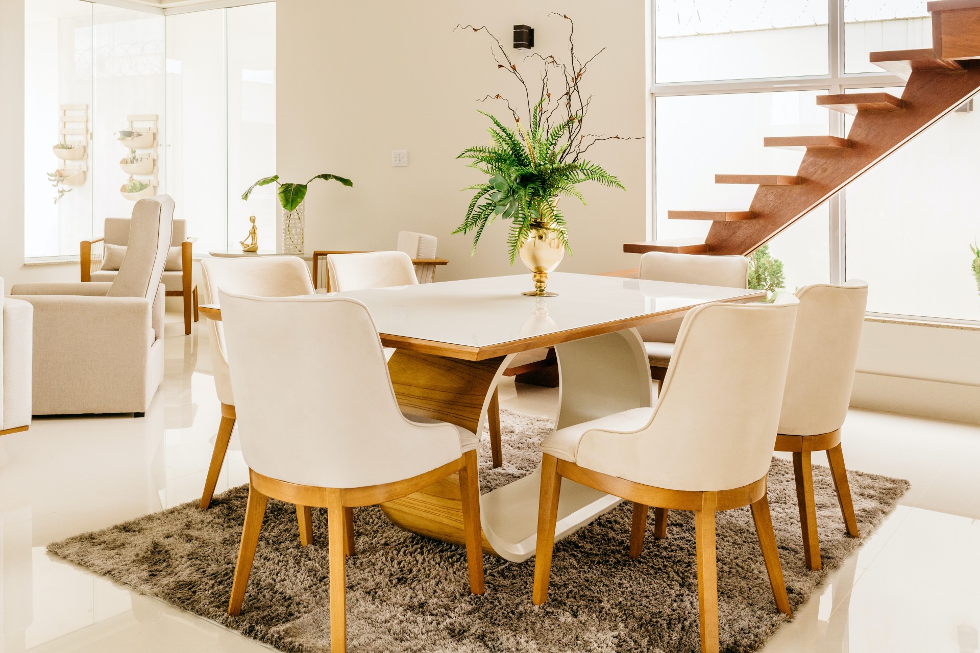 White dining room with beige rug