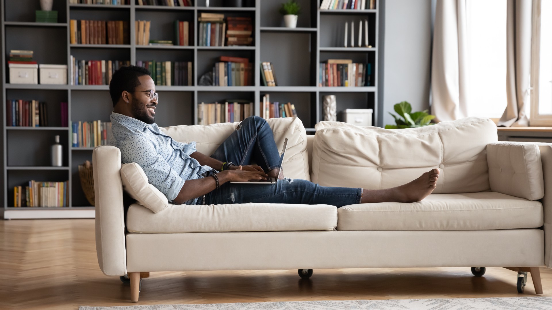 man lounging on couch