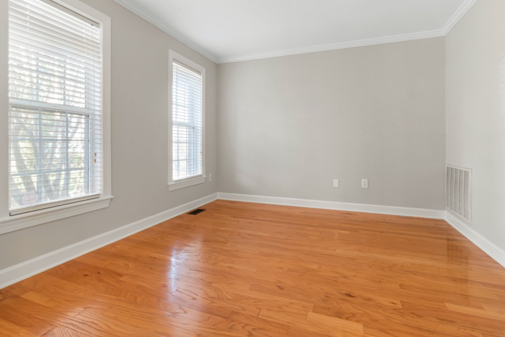 neutral room with wood floor