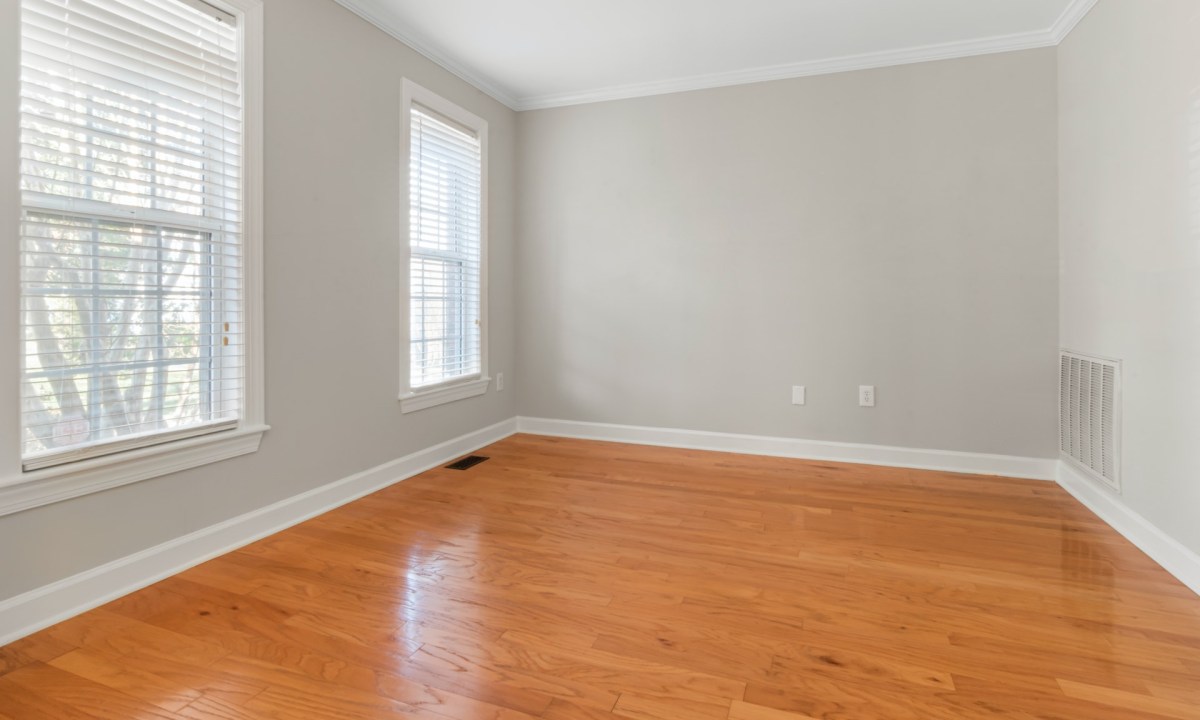 neutral room with wood floor