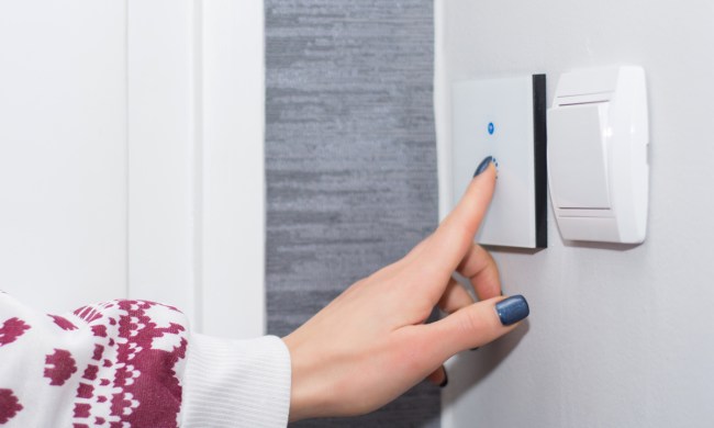 Woman's hand on a smartlight switch