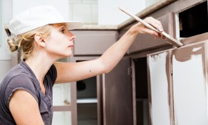 affordable kitchen cabinets replace woman painting