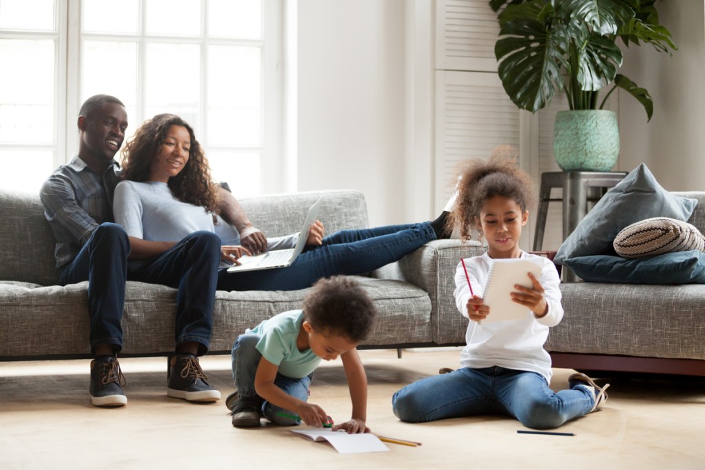 Family enjoying couch in casual family room